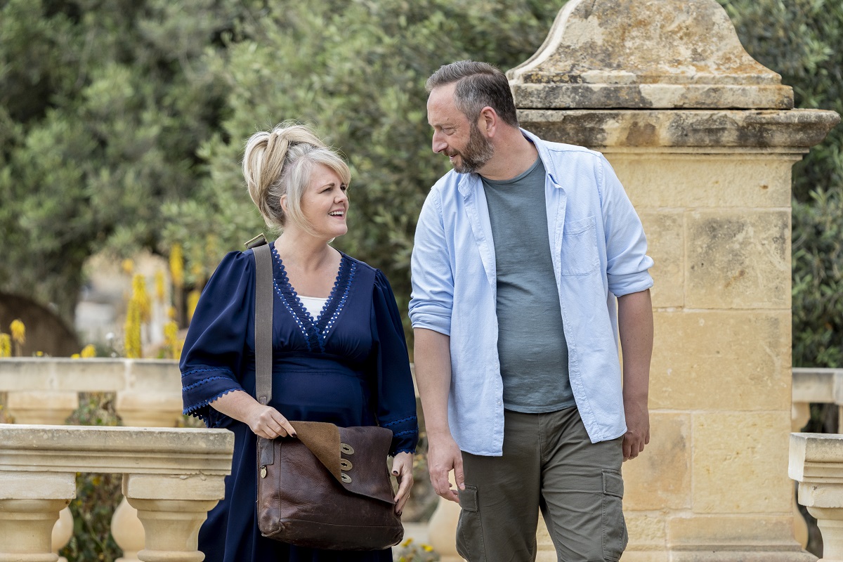 Sally Lindsay as Jean and Steve Edge as Dom - The Madame Blanc Mysteries _ Season 1, Episode 2 - Photo Credit: Mark Cassar/AcornTV Sally Lindsay as Jean and Steve Edge as Dom - The Madame Blanc Mysteries _ Season 1, Episode 2 - Photo Credit: Mark Cassar/AcornTV